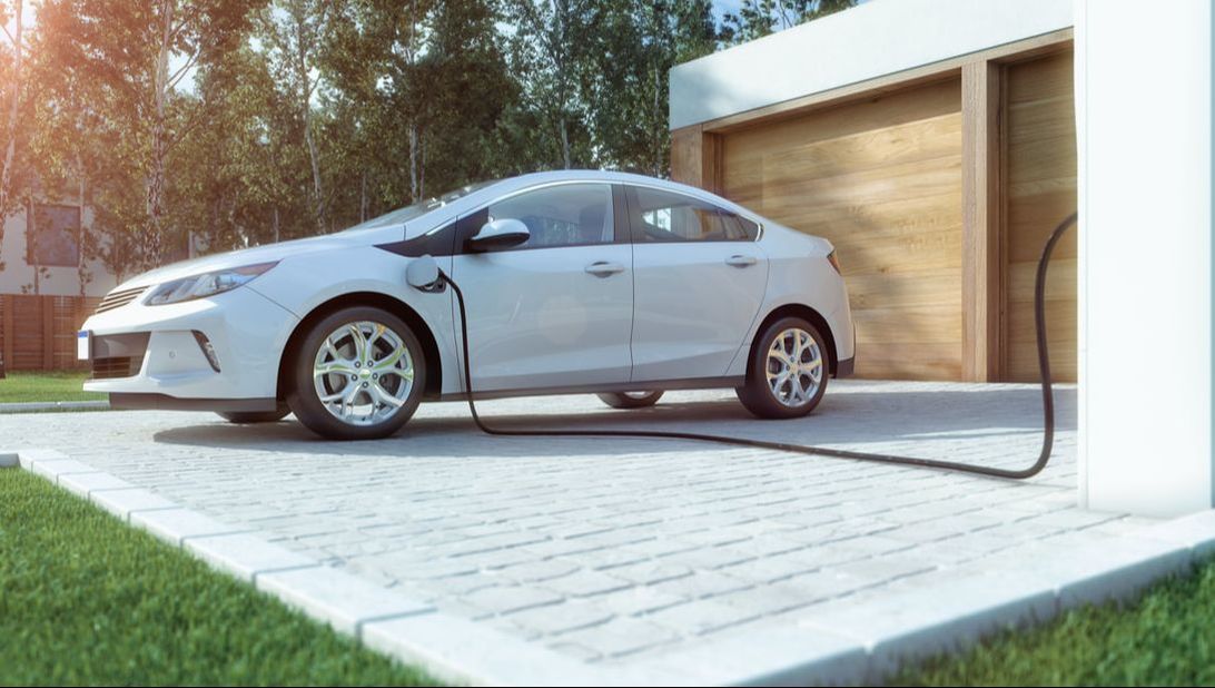Electric car charging in driveway